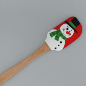 spatule en bois et silicone avec un magnifique bonhomme de neige, une sélection d'Assiettes et cie